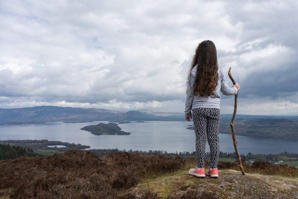 Child Looking out Over Fjord Photo by Gary Ellis